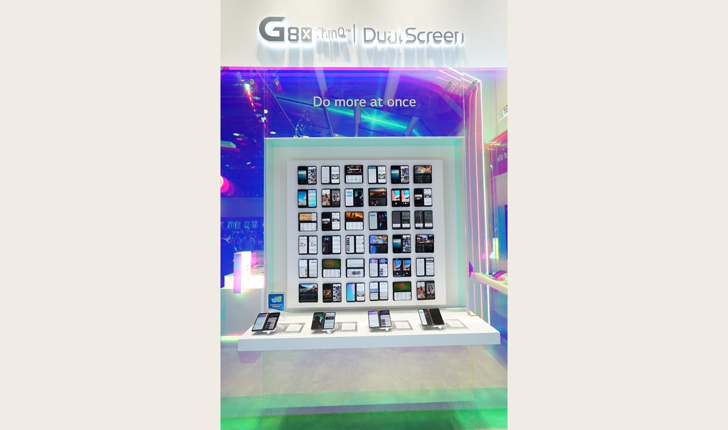 A front view of LG G8X ThinQ’s and Dual Screen’s main display at CES, with four devices placed in front of a large screen illustrating their limitless applications