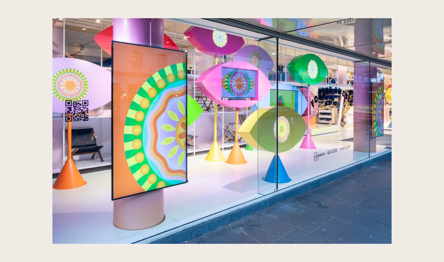 LG OLED evo TVs featured in Yinka Ilori's art installations titled 'Forest of Eyes' in the display window at the Conrad Shop