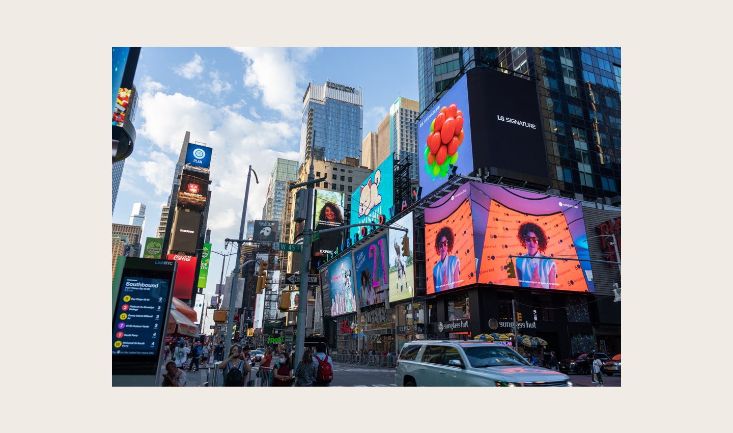 LG's digital billboard in Time Square, New York displaying an animation of plump grapes representing the function of LG SIGNATURE Wine Cellar