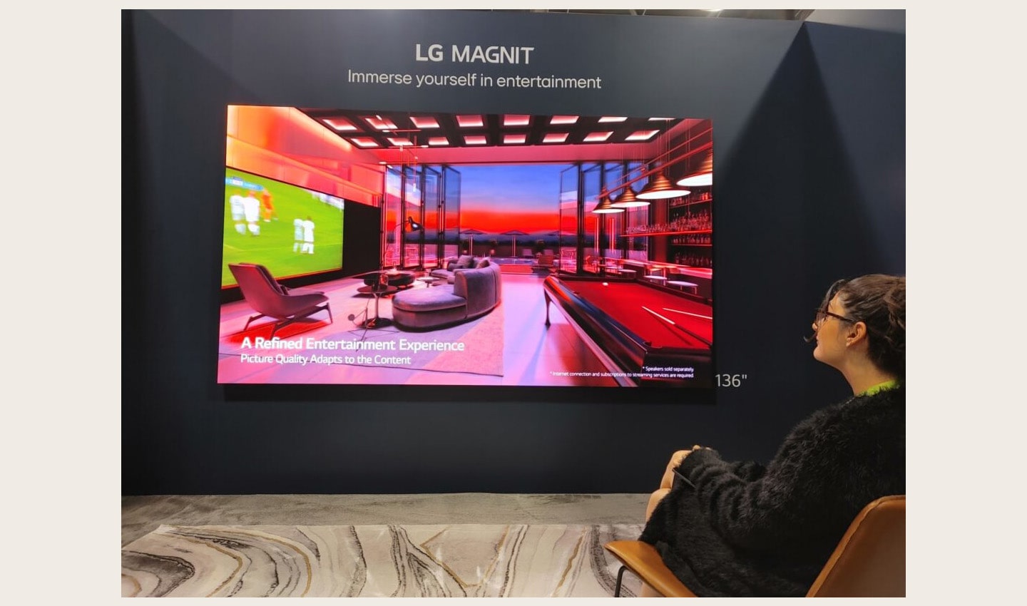 A visitor taking a look at LG MAGNIT installed at HITEC 2023