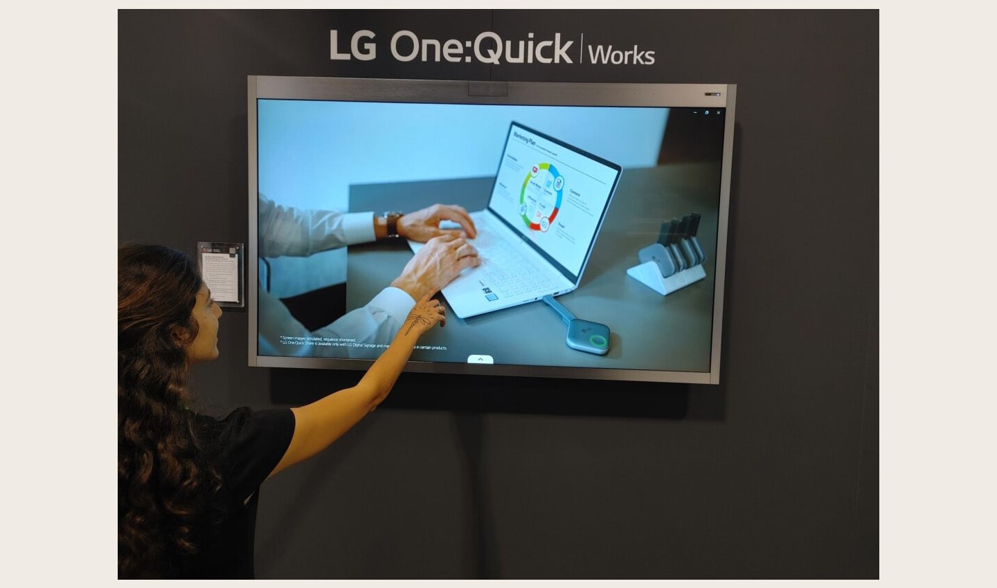 A visitor enjoying a first-hand experience of LG One:Quick Works