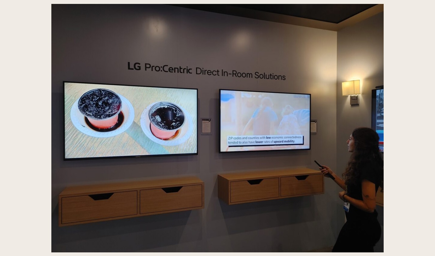 A visitor enjoying a first-hand experience of LG Pro:Centric Direct In-Room Solutions