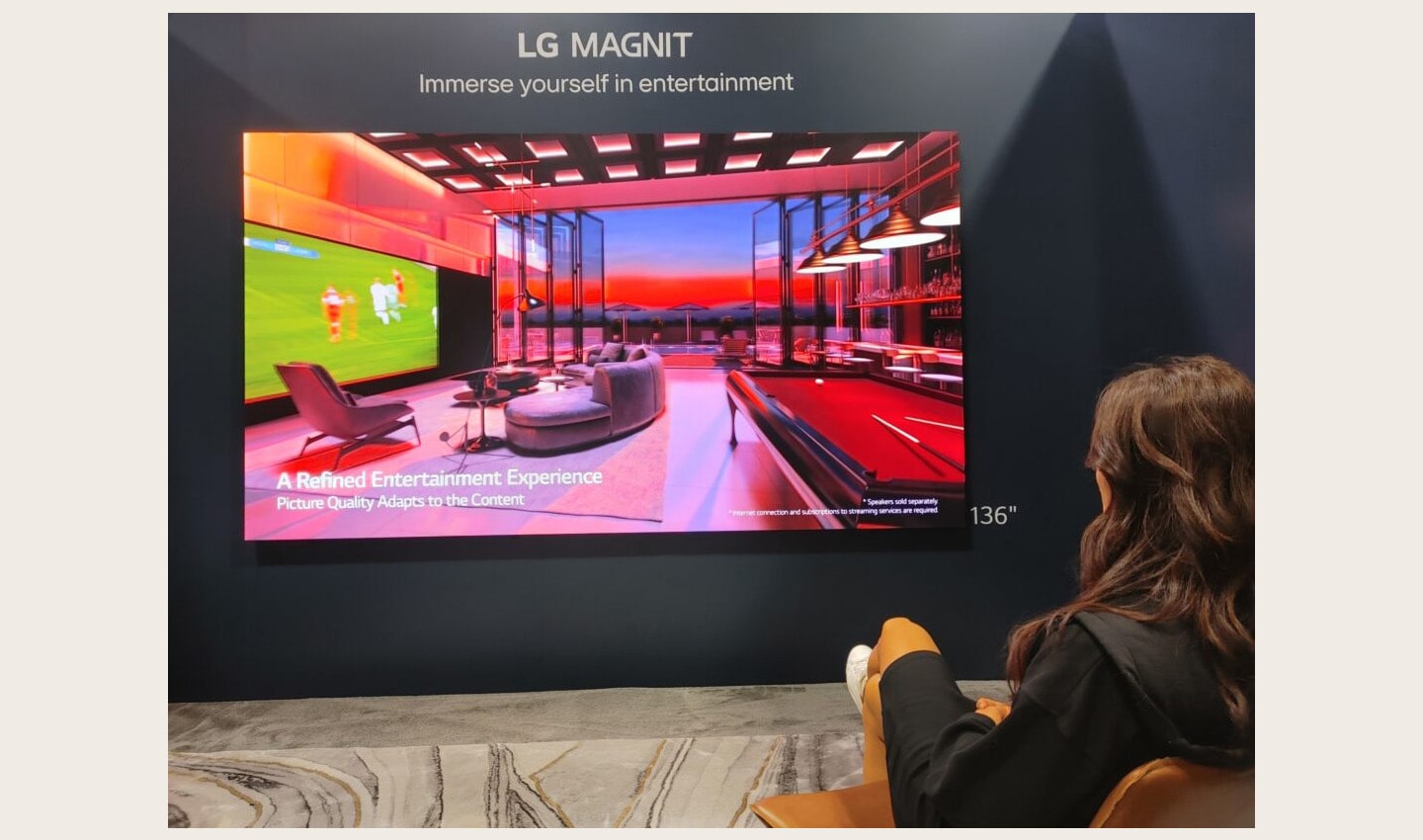 A visitor taking a look at LG MAGNIT installed at HITEC 2023