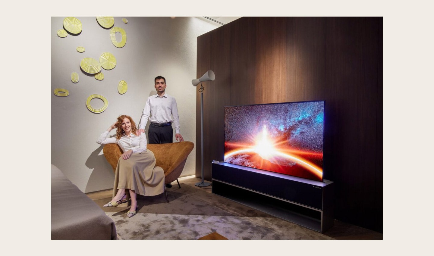 Two visitors posing with LG OLED R during Milan Design Week 2022