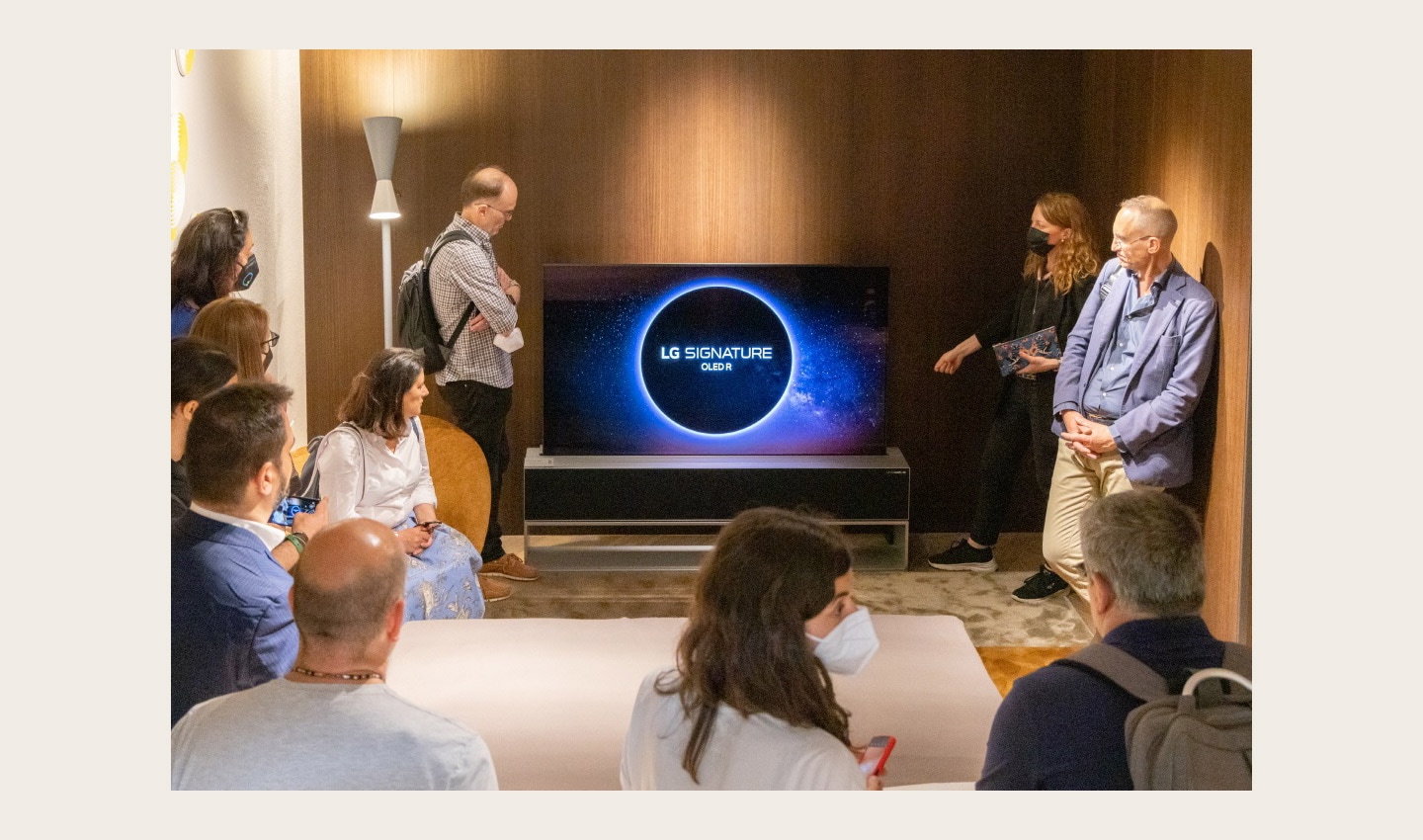 Visitors taking a closer look at LG OLED R during Milan Design Week 2022