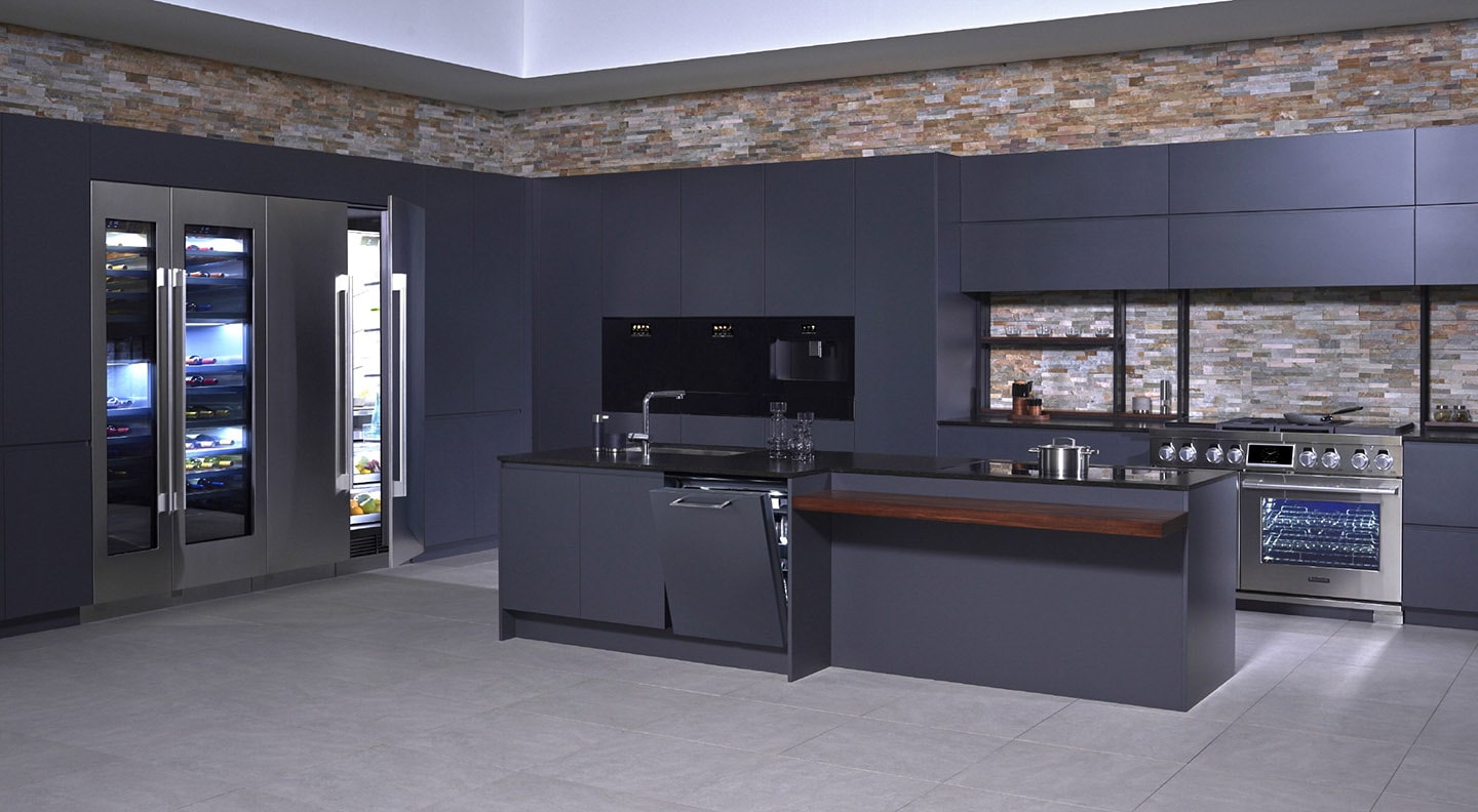 A kitchen consisting of SIGNATURE KITCHEN SUITE collection in black backdrop with brick walls