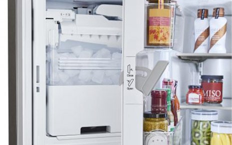 LG refrigerator partially opened to show the interior of its door-ice maker.