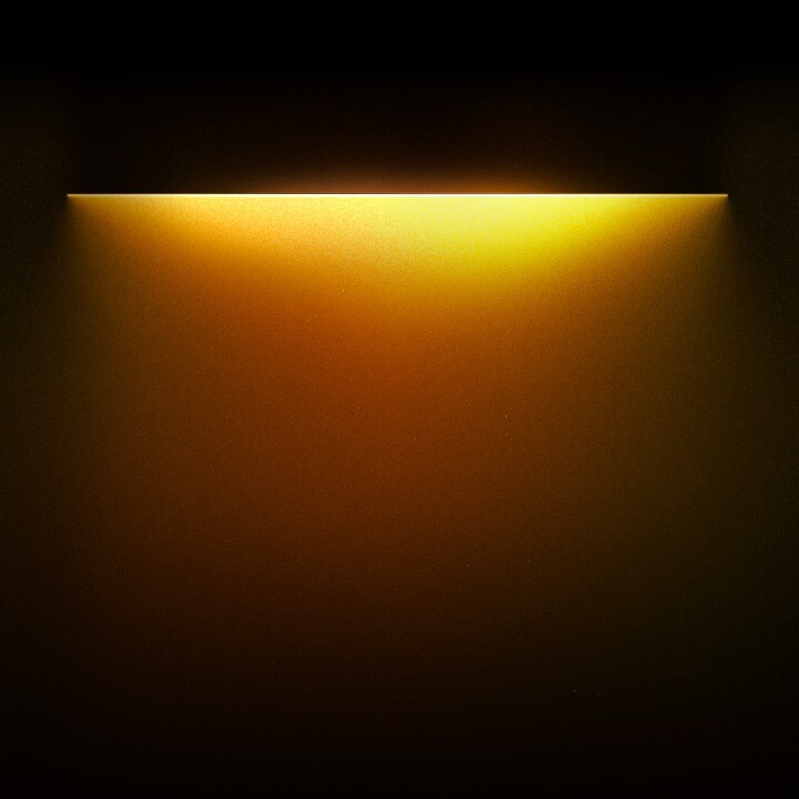 Yellow colored light gradationally spotlighting the text 'For technology that frees you' below.