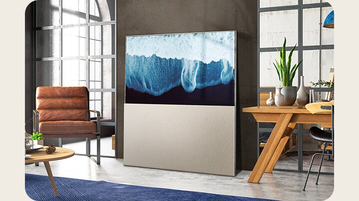 An elegant home with the LG OLED Objet Collection Easel positioned against the wall. At this angle, it almost looks like a work of art rather than a TV.	