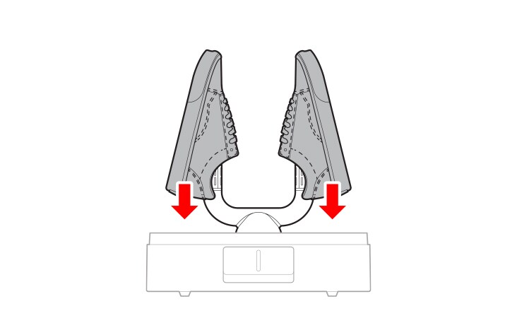 The shoes are placed onto the drying rod, with the arrow pointing downward.	