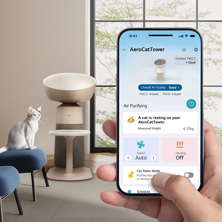 Image of a cat sitting on a sofa in the living room, staring forward, with the LG ThinQ app AeroCatTow main screen displayed	