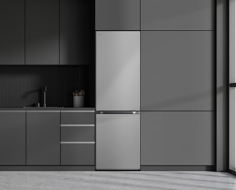 Modern kitchen with a refrigerator that blends seamlessly into surrounding cabinetry, resembling a built-in model.