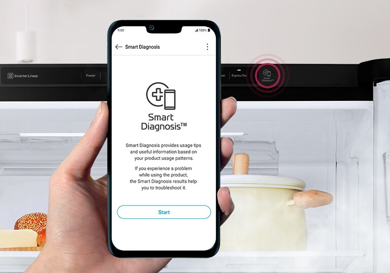 Hand holding smartphone with LG Smart Diagnosis app in front of open fridge, showing diagnostic information on the screen.