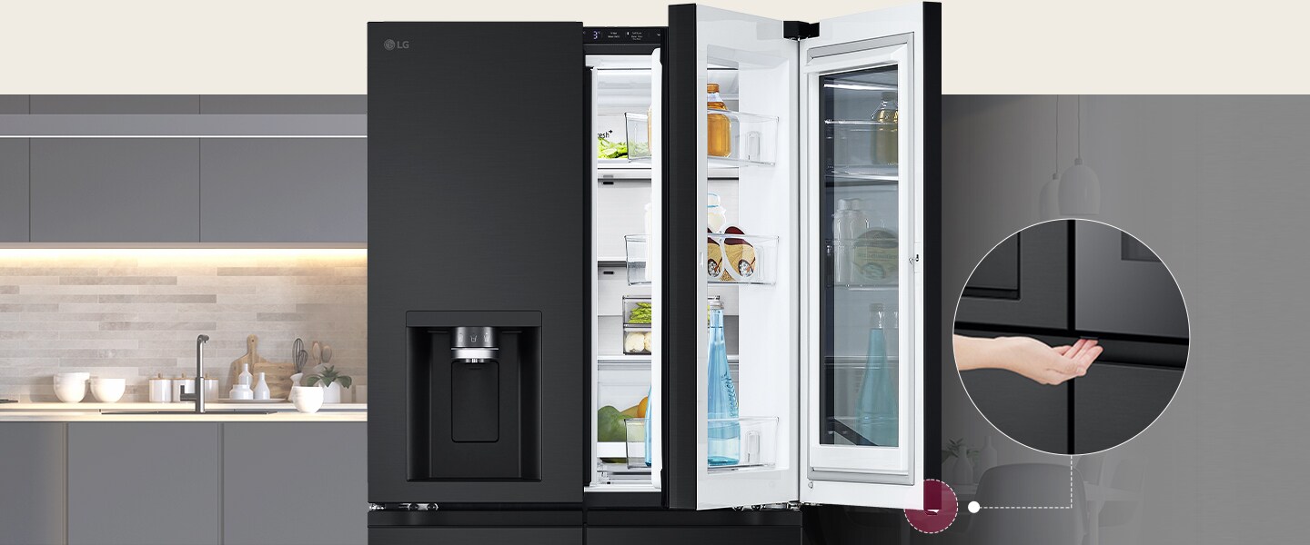 LG black double-door fridge with water dispenser, open to show organized shelves, in a modern grey kitchen.