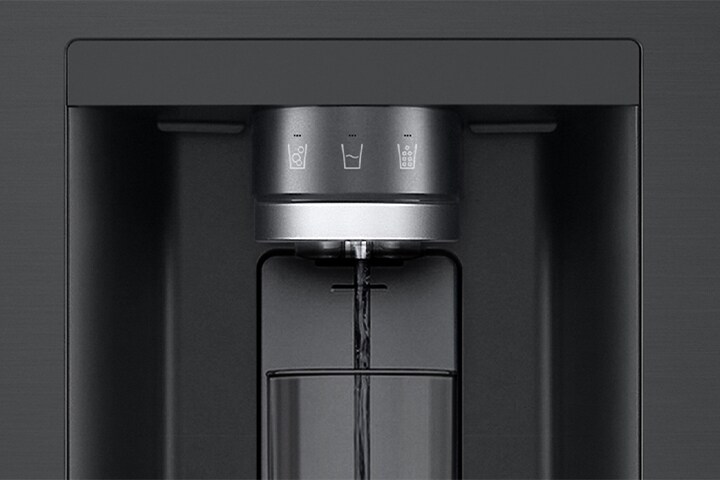 LG refrigerator water dispenser with illuminated touch controls and water flow into a clear glass.