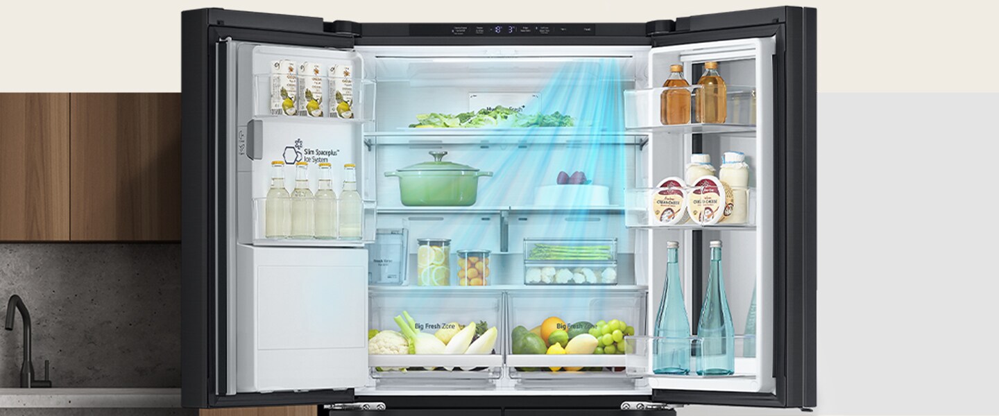 LG refrigerator with organized shelves in a modern kitchen, displaying drinks, fruits, vegetables, and dairy products.