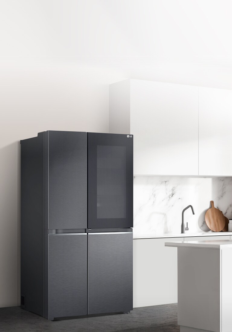 A side view of a kitchen with a black InstaView refrigerator installed.