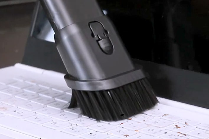 Image of using the Combination Tool to remove dust from a laptop