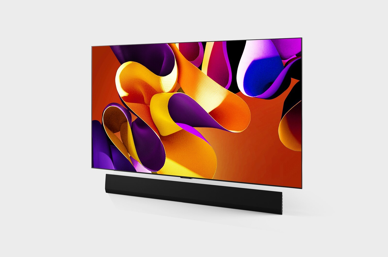 Slightly-angled left-facing side view of LG OLED evo TV, OLED G4 on the wall with the Soundbar below