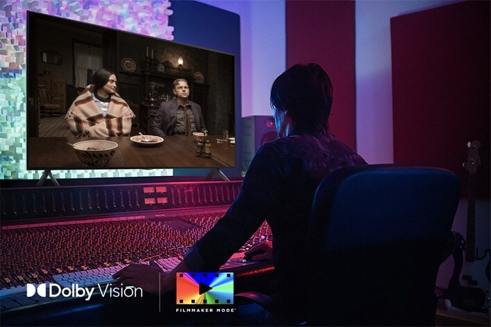 A director in front of a control panel editing the movie "Killers of the Flower Moon" on an LG QNED TV. In the bottom left, the Dolby Vision logo and FILMMAKER MODE logo.