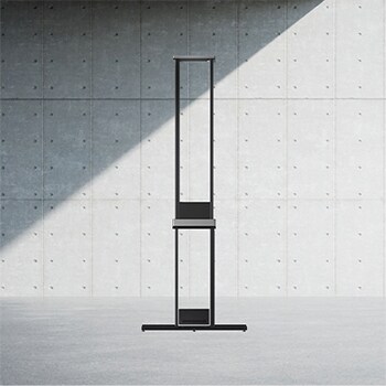 Side view of LG SIGNATURE OLED T with the Zero Connect Box placed on the floor directly below. 