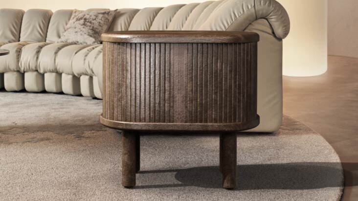 Spacious and clean living room without any wire clutter. A small side table opens up to reveal the Zero Connect Box inside it. The compartment closes to hide the Zero Connect Box, showing how visually tidy everything is with the LG True Wireless solution.	