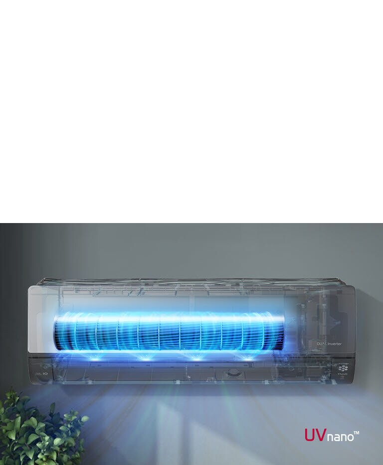 Condizionatore LG Dual Inverter UVnano illuminato di blu, montato su una parete grigia, con una pianta in basso a sinistra.