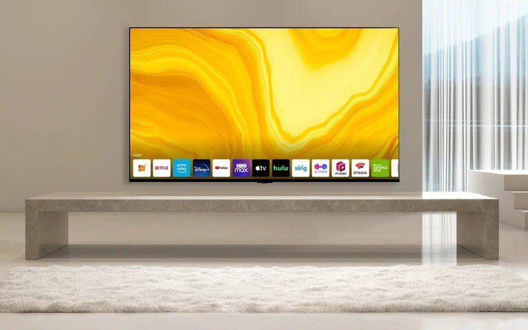 Un moderno soggiorno minimalista con un elegante TV LG, posto sopra un mobile in pietra, che mostra un’opera d’arte di colore giallo. Il design semplice ed elegante ne sottolinea lo stile e le funzionalità.