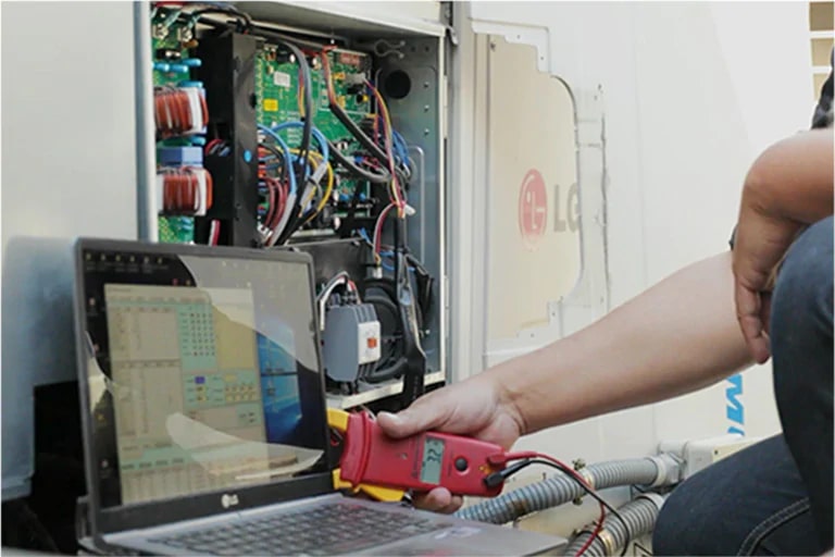 A engineer is checking the Multi V outdoor unit.