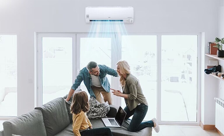 Family members are happy in the cool air conditioner wind in the living room.