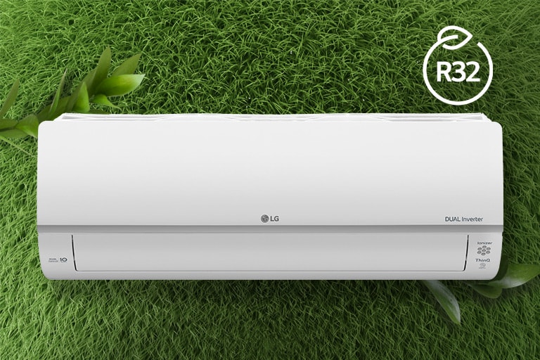 The LG Air conditioner is installed on a wall of grass. The R32 logo for energy efficiency is in the upper right corner.