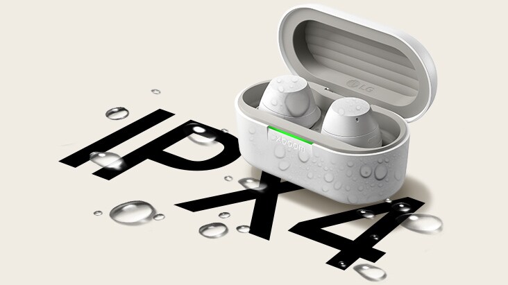 A white xboom Buds cradle is placed with its light on and with a pair of earbuds in it facing diagonal. Below the cradle there's some water drops on the floor and the cradle is partially having water splash.
