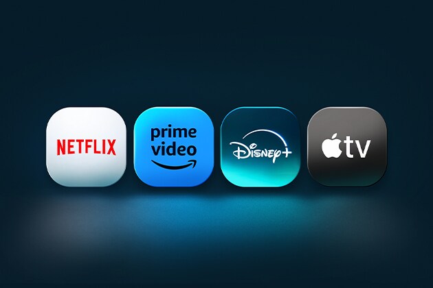 De logo’s van de Netflix, Prime Video, Disney+ en Apple TV apps staan naast elkaar op een blauwe achtergrond. 