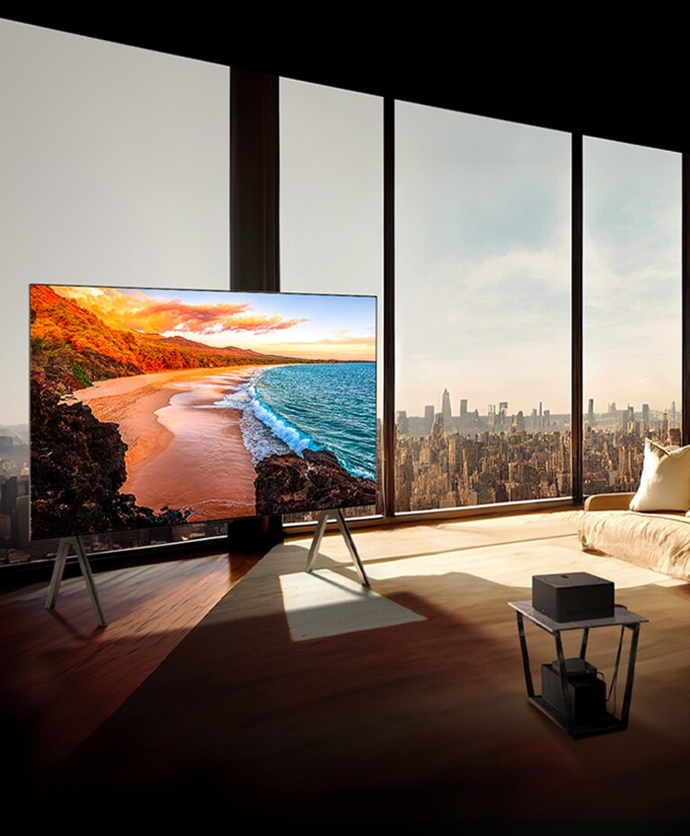 LG SIGNATURE OLED M4 op een standaard voor een hoog raam in een zonnig, modern appartement.