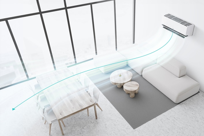 Sala de estar con aire acondicionado LG y doble aleta, distribuyendo el flujo de aire eficientemente en el comedor y sofá.