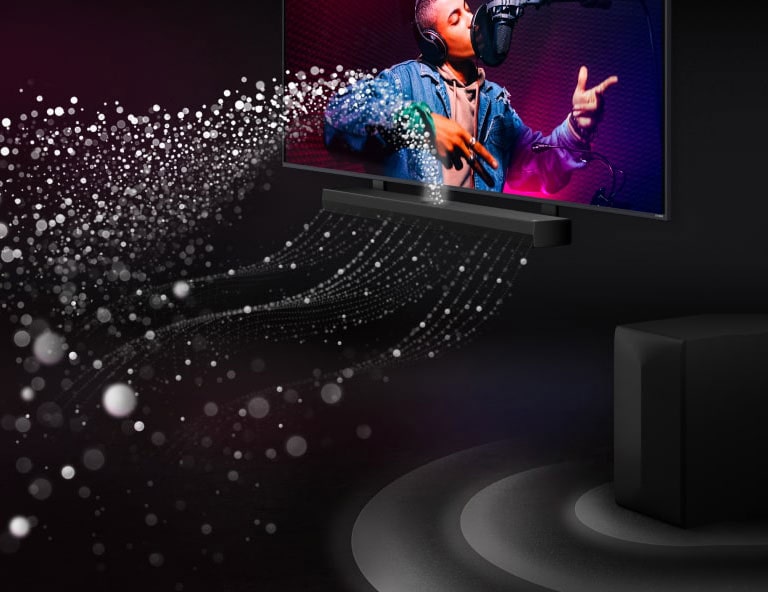 LG Soundbar and LG TV in a black room playing a musical performance. White droplets representing soundwaves shoot upwards and forward from the soundbar. A subwoofer is creating a sound effect from the bottom.