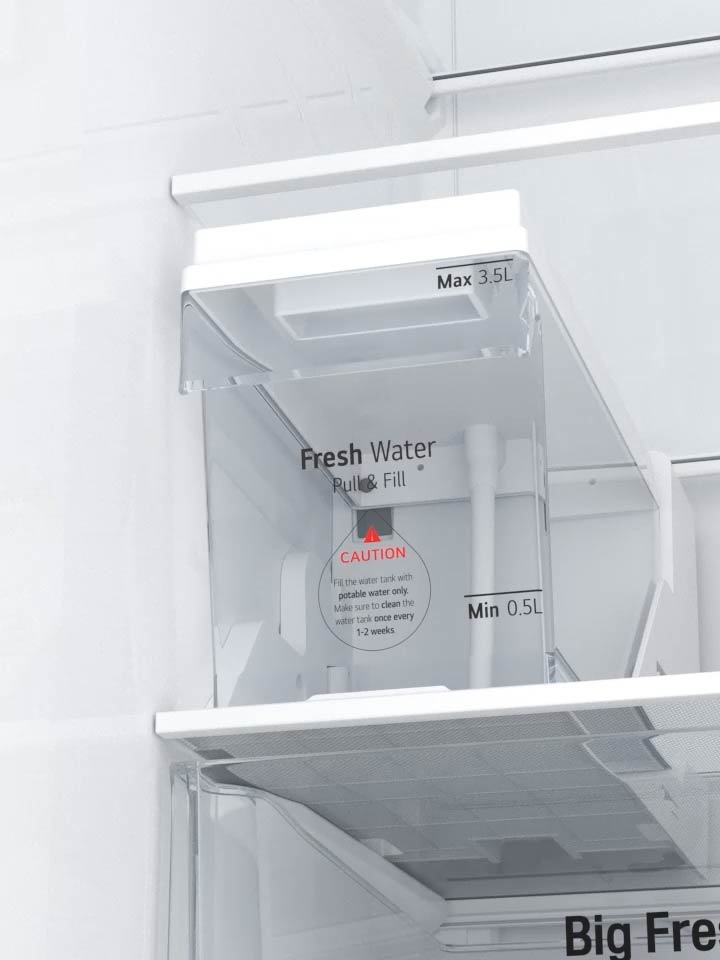 User opening the Slim SpacePlus Ice System compartment in an LG refrigerator	
