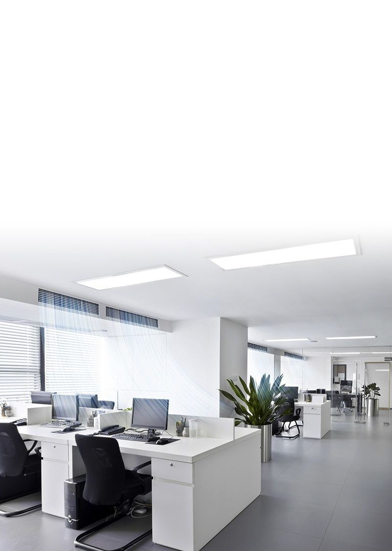 Ceiling cassette type air condition unit dispenses blue-colored air current in an office featuring monotone desks and chairs with a meeting room to the right . 