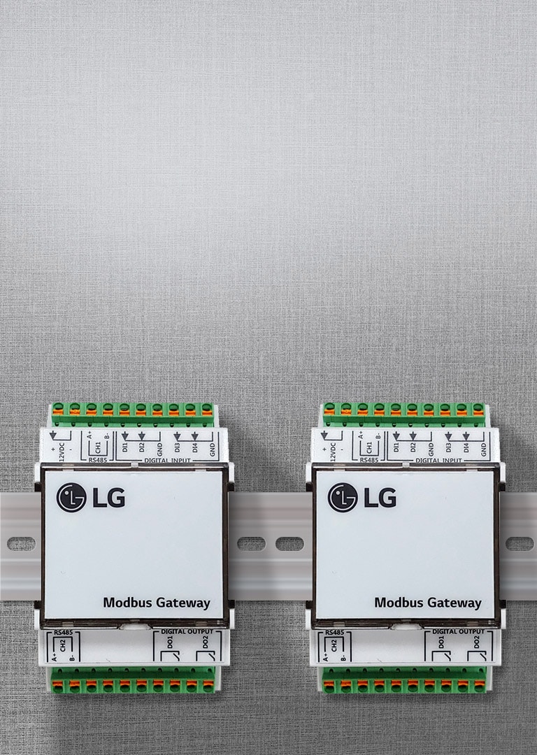 Two LG Modbus Gateway devices mounted on a wall, labeled for easy integration of LG air conditioners with building systems.