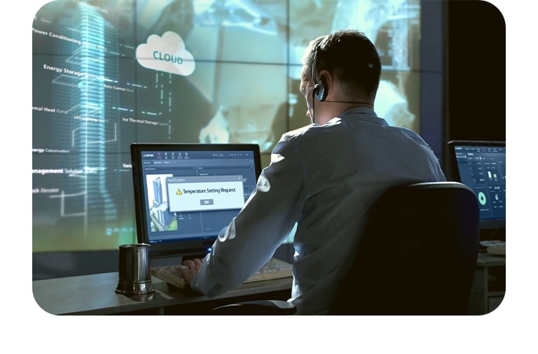 A technician wearing a headset is seated in front of multiple computer screens displaying HVAC system data for service and maintenance, with a backdrop of digital graphics and cloud icons.