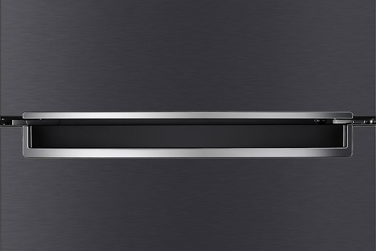 A close up photo of the center of the refrigerator showcasing the elegant and minimalistic handle.