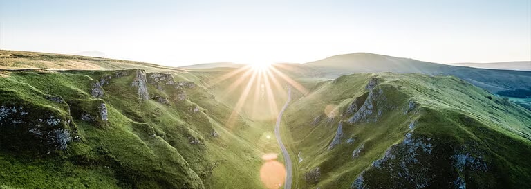 image of sunset right at the top of the valley