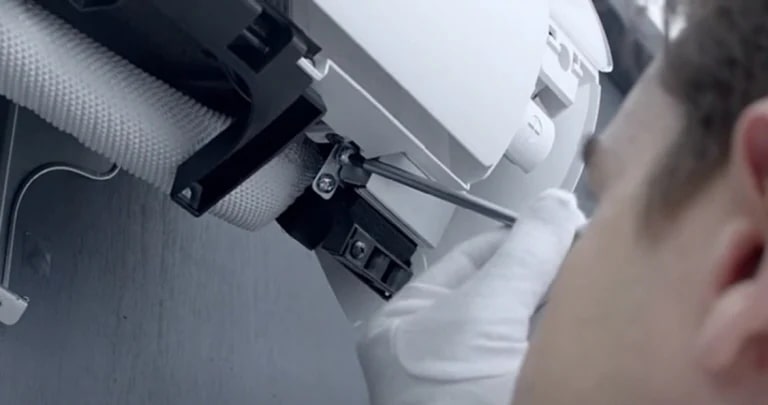 A technician repairing an airconditioner.