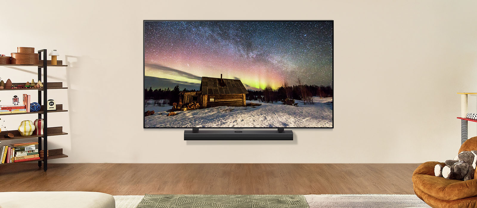 LG TV and LG Soundbar in a modern living space in daytime. The screen image of the aurora borealis is displayed with the ideal brightness levels.	