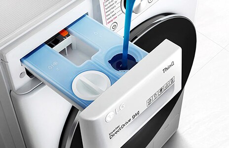 This is an image of putting detergent into the washing machine.