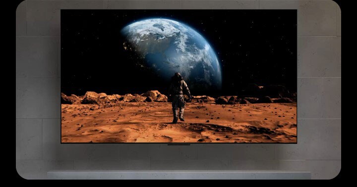 Huge typography, True Wireless. Typography fades to reveal a TV with a messy setup of wires underneath it. Suddenly, the wires disappear and the TV is mounted even deeper to the wall for a cleaner look, highlighting how LG True Wireless OLED TVs eliminate cable clutter and allow for easy flush-fit installation.