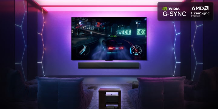 Living room with a wall-mounted LG True Wireless TV. On the screen is a racing game in 4K. The scene zooms into the game to highlight the immersive quality of the TV. As the car accelerates through the race track, the 144Hz refresh rate and smooth gameplay is showcased.