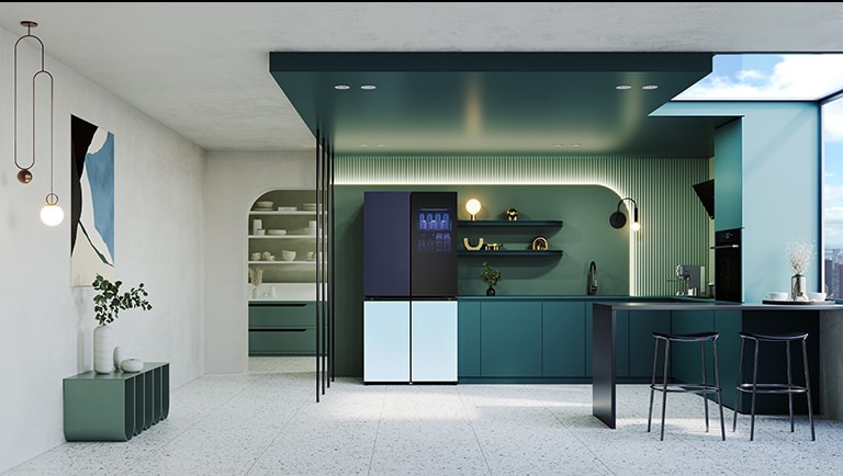 In the image of a kicthen in green tones, a refrigerator is placed in the middle.