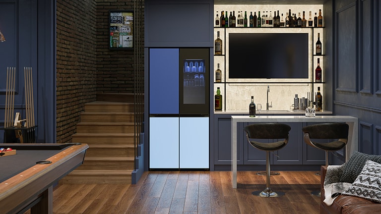  In the image of a modern living room in orange tones, a refrigerator is placed on the left.