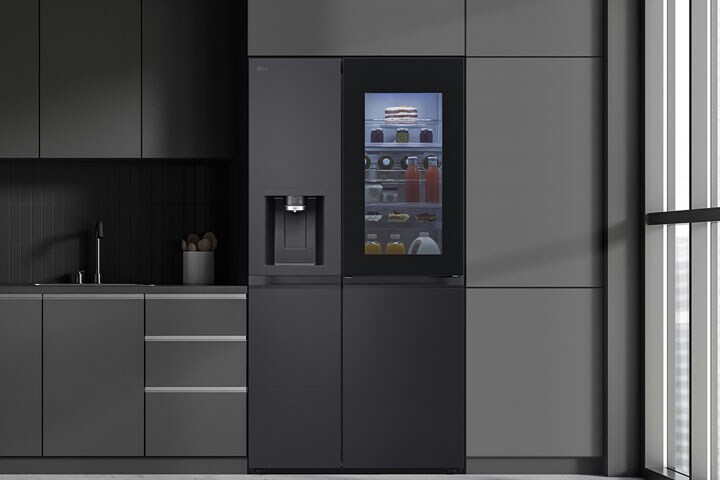 Modern kitchen with a refrigerator that blends seamlessly into surrounding cabinetry, resembling a built-in model.